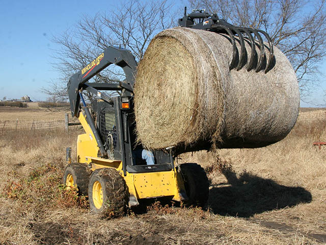 The new Bradco Quik Pik grapple attachment works on more than hay bales. It can tackle brush, logs, rocks, pipe and culverts too. (Photo courtesy of Paladin Attachments)